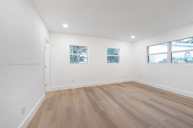 unfurnished room featuring light hardwood / wood-style floors