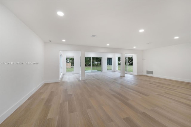 unfurnished living room featuring light hardwood / wood-style floors