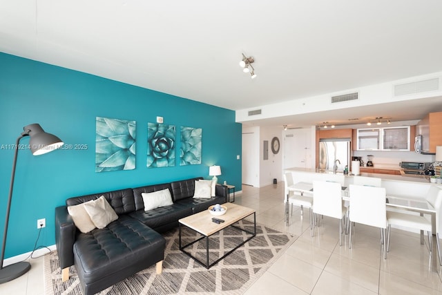 living room with light tile patterned floors