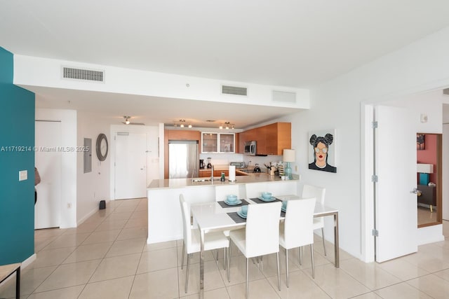 dining room with light tile patterned floors