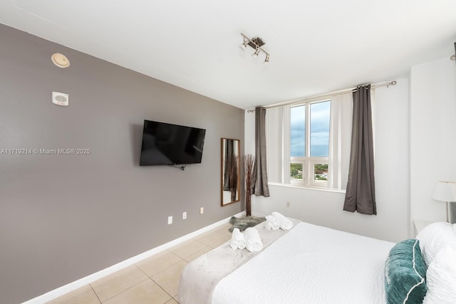 bedroom with light tile patterned flooring