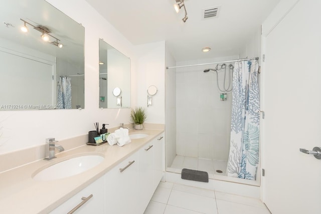 bathroom featuring vanity, tile patterned floors, and a shower with curtain