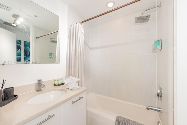 bathroom with vanity and shower / bath combo with shower curtain