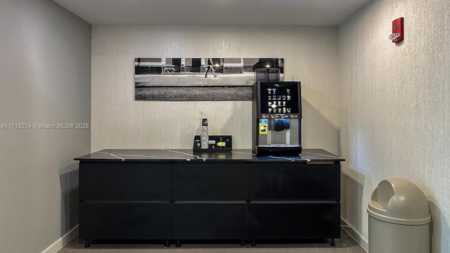 bar featuring light tile patterned flooring