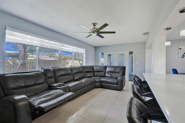 tiled living room with ceiling fan