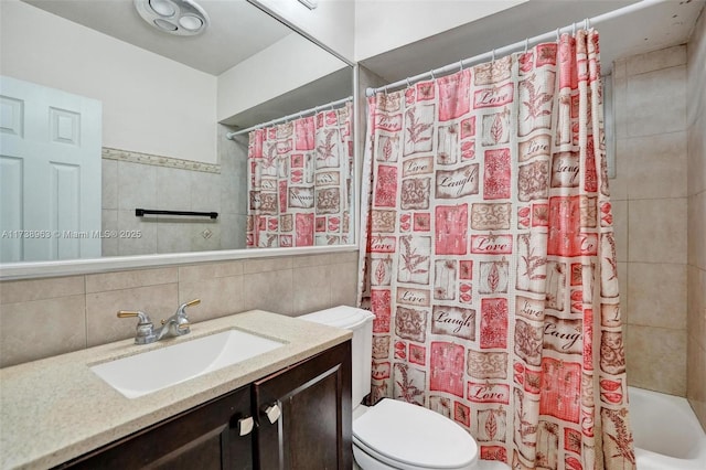 full bathroom with tile walls, shower / tub combo, vanity, tasteful backsplash, and toilet