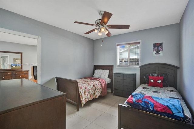 bedroom with light tile patterned flooring and ceiling fan