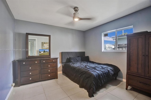 bedroom with light tile patterned flooring and ceiling fan