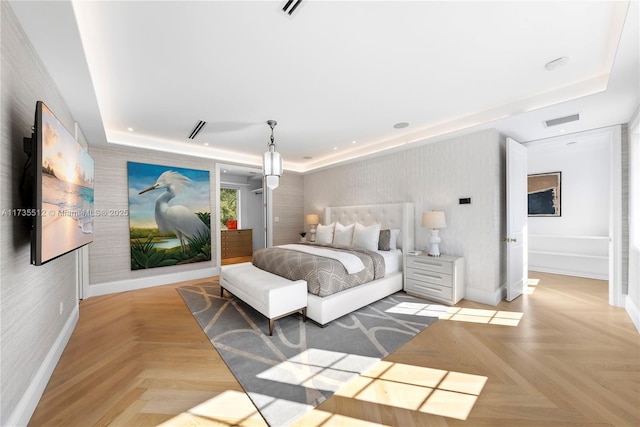 bedroom featuring wallpapered walls, baseboards, visible vents, and a raised ceiling