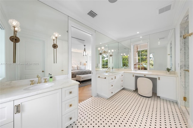 bathroom with vanity and an inviting chandelier