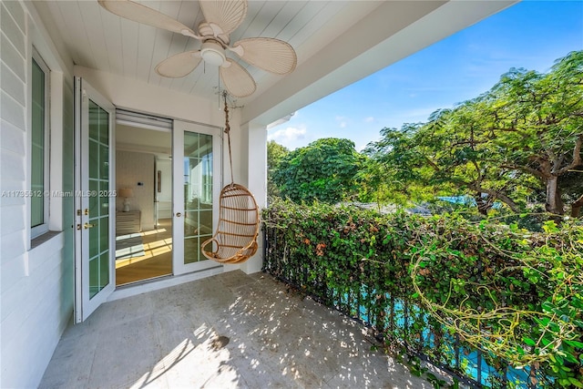 view of patio featuring ceiling fan