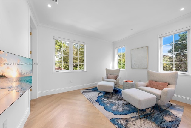 living area featuring crown molding and light parquet floors