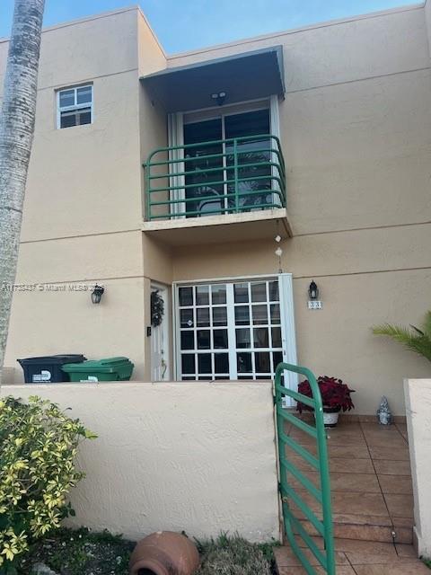 entrance to property featuring a balcony