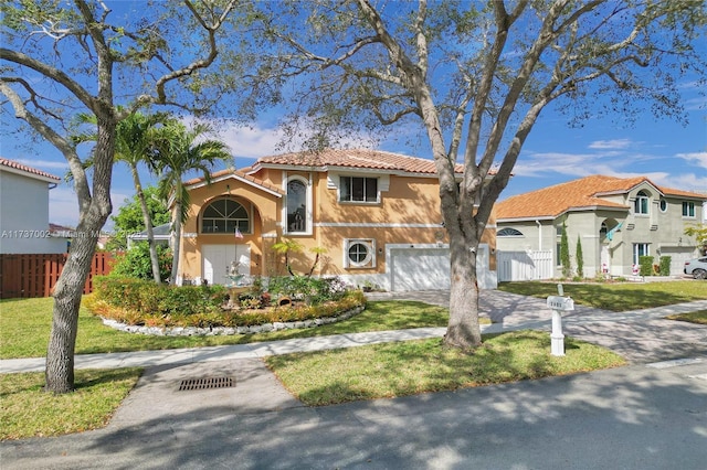 mediterranean / spanish house featuring a garage