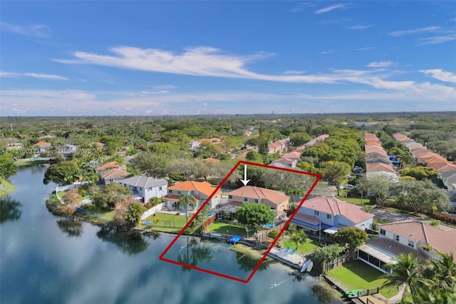 birds eye view of property with a water view