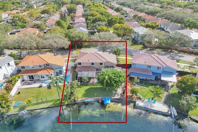 birds eye view of property with a water view