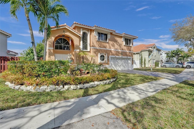 mediterranean / spanish-style home with a garage and a front lawn