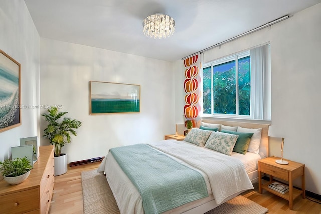 bedroom with light hardwood / wood-style floors