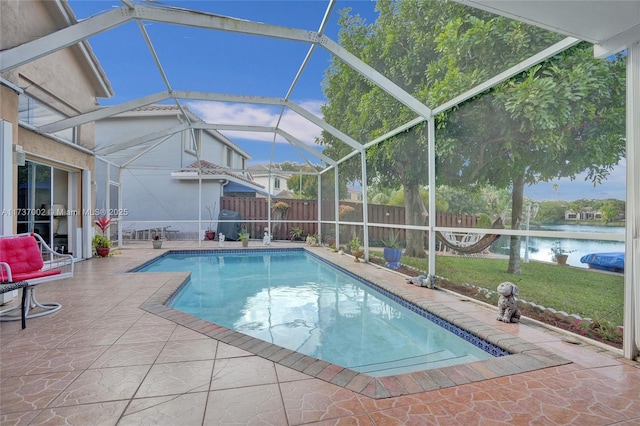 view of swimming pool with a patio and glass enclosure