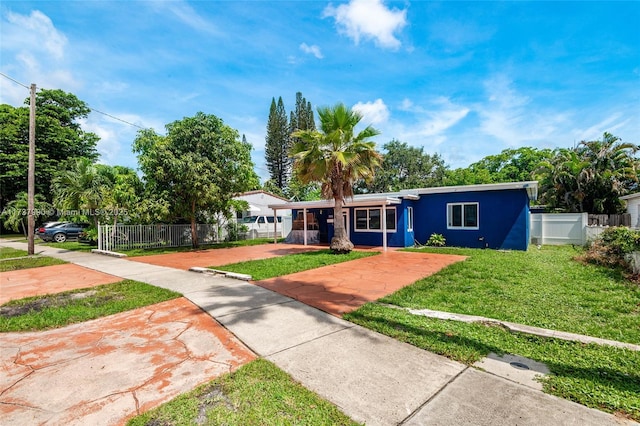 ranch-style house featuring a front lawn