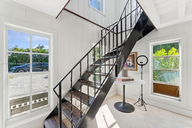 staircase with wooden walls