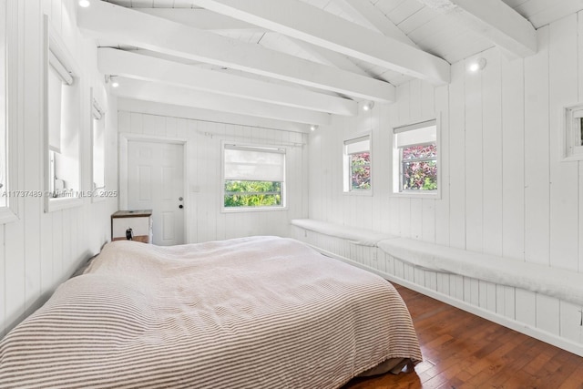 bedroom featuring lofted ceiling with beams and dark wood-type flooring