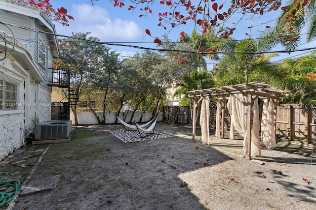 view of yard featuring stairs, central AC, a patio area, and a fenced backyard