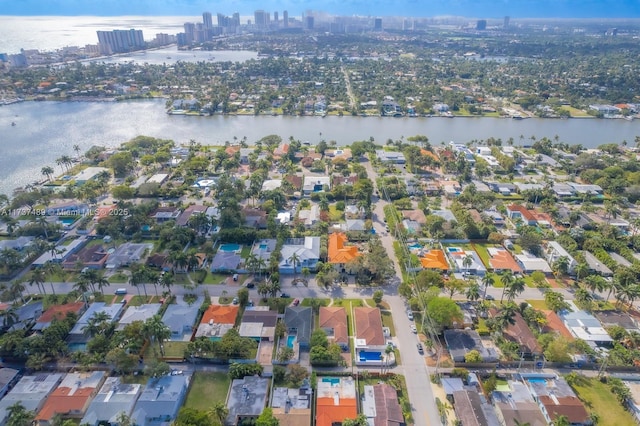 bird's eye view with a water view, a residential view, and a city view