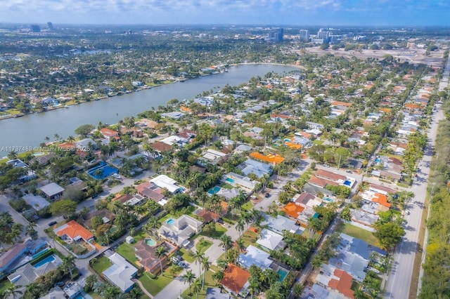 birds eye view of property featuring a water view and a residential view