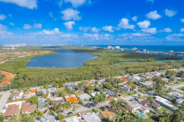 bird's eye view with a water view and a residential view