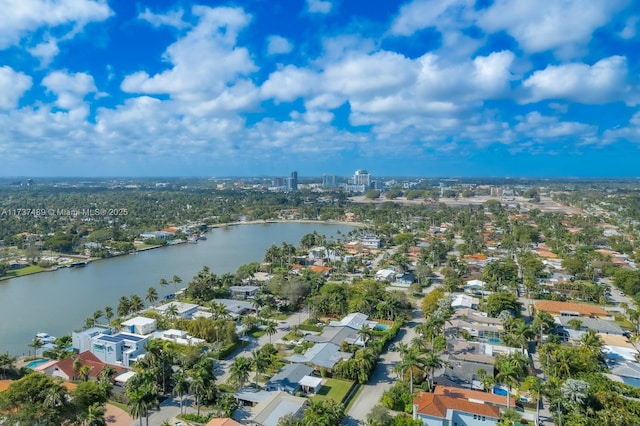 birds eye view of property featuring a water view and a residential view