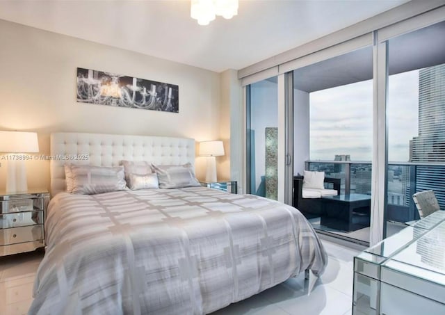 bedroom with light tile patterned flooring and a wall of windows