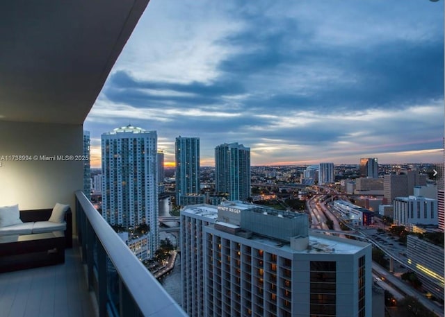 view of balcony at dusk