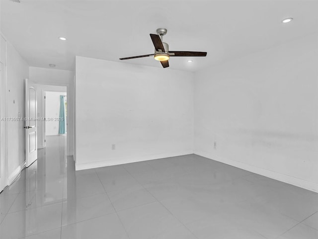 unfurnished room with ceiling fan