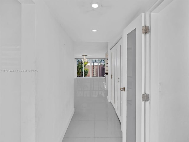 corridor featuring light tile patterned flooring