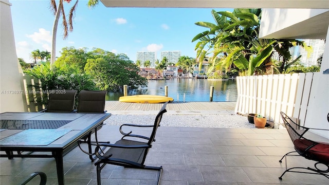 view of patio / terrace featuring a water view and a boat dock