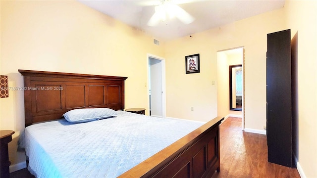 bedroom featuring hardwood / wood-style floors and ceiling fan