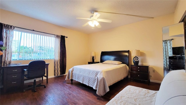 bedroom featuring ceiling fan and dark hardwood / wood-style flooring