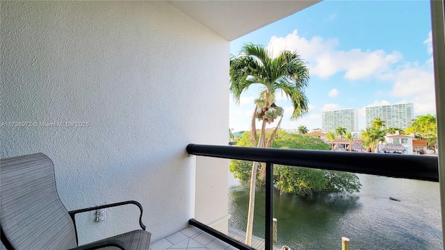 balcony featuring a water view