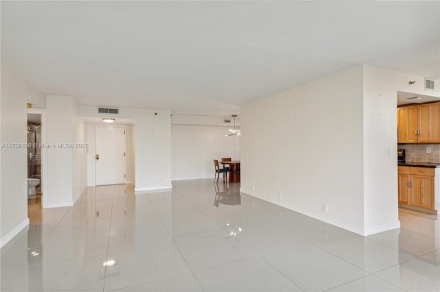 empty room featuring light tile patterned floors