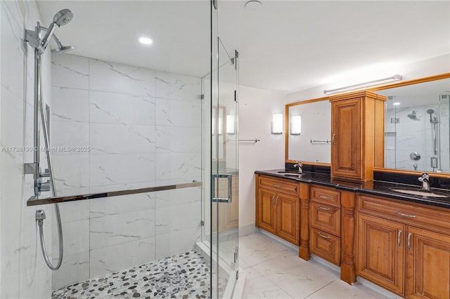 bathroom featuring vanity and a shower with door