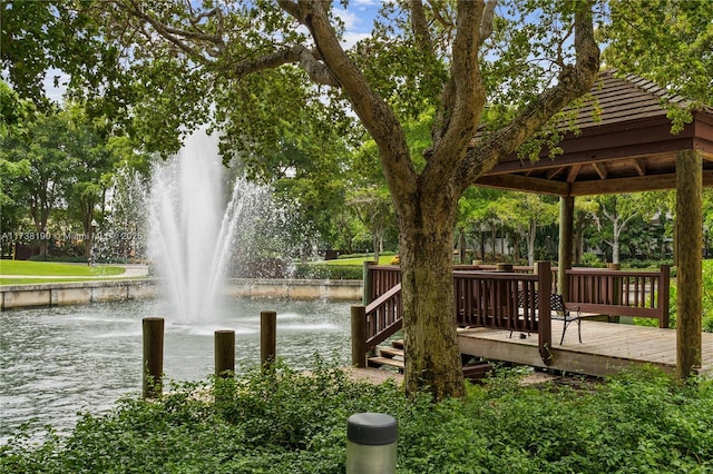 surrounding community featuring a water view and a gazebo