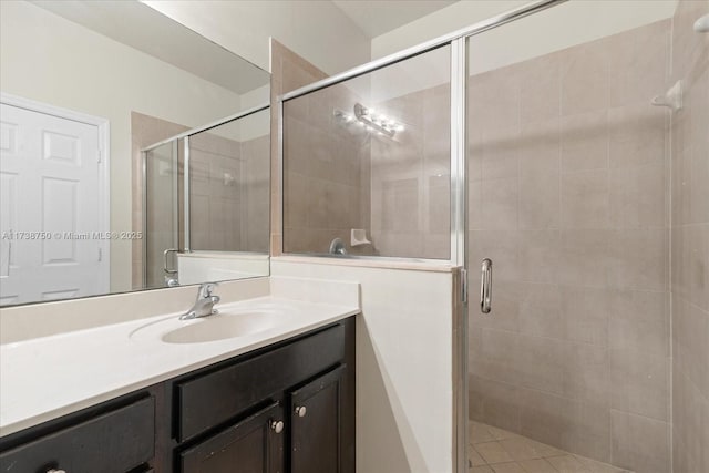 full bathroom with a stall shower and vanity