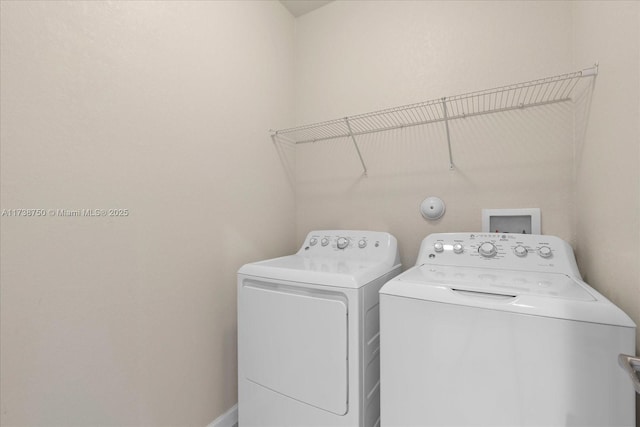 laundry area featuring laundry area and washing machine and dryer