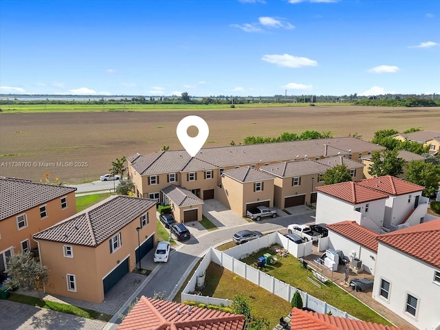 birds eye view of property with a residential view