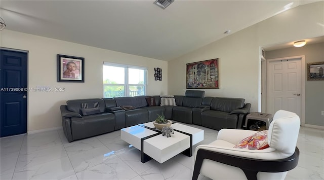 living room featuring lofted ceiling