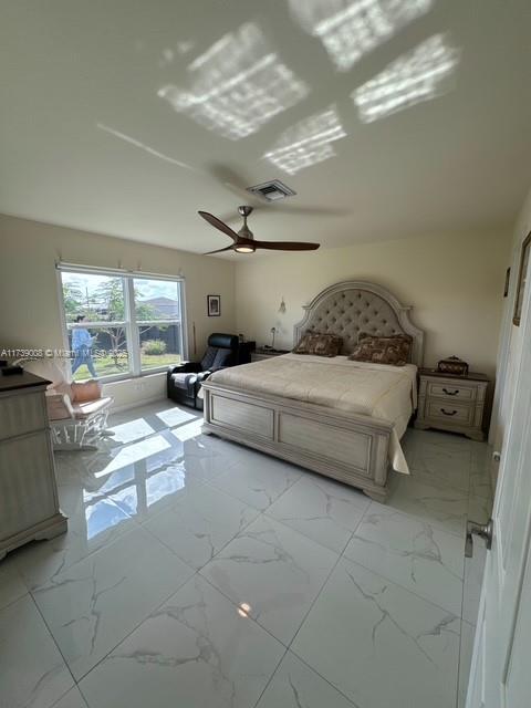 unfurnished bedroom featuring ceiling fan