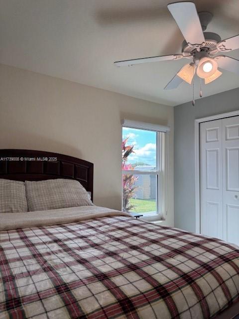 bedroom with a closet and ceiling fan