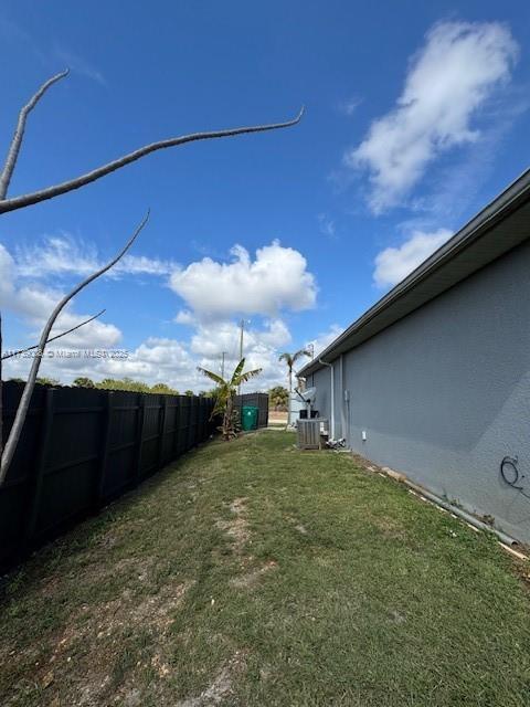 view of yard featuring central AC unit