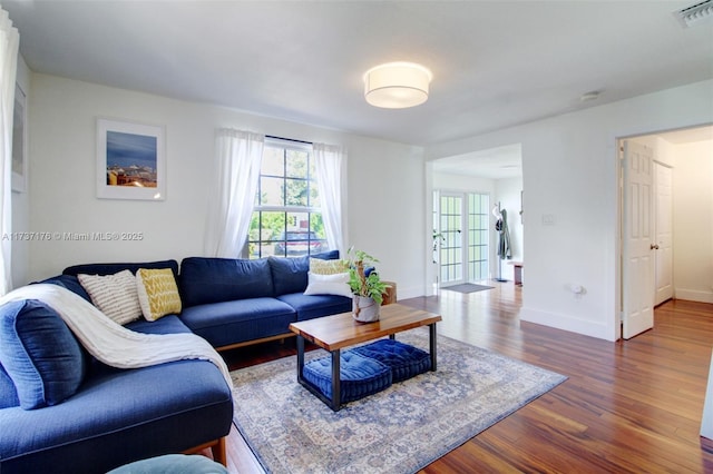 living room featuring dark hardwood / wood-style flooring